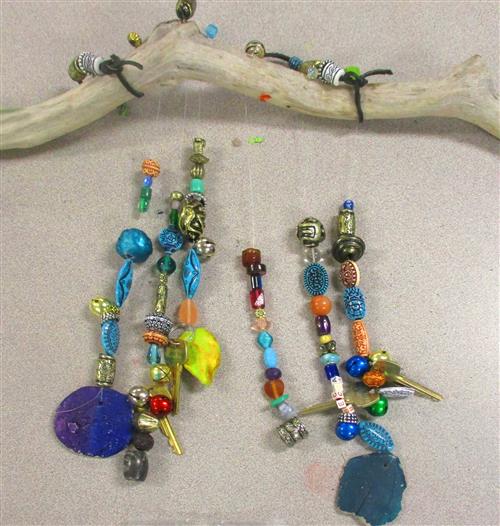 Glass Beaded wind chimes hung from driftwood stick